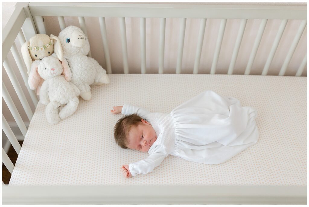newborn baby lying in crib